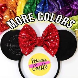 May include: Red sequin Minnie Mouse ears with a black headband and a white circle with the text "Minnie Castle" in pink and yellow. The text "MORE COLORS" is written in white on a black background. There are multiple colors of sequin bows in the background.