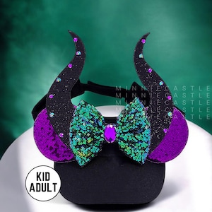 May include: Black and purple headband with a green and purple glitter bow and black horns. The headband says "Kid Adult" on the side.