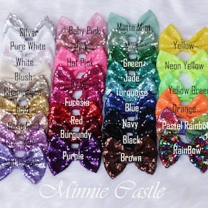 May include: A collection of 24 sequined bows in various colors, including silver, white, baby pink, hot pink, rose, fuchsia, red, burgundy, purple, light purple, lavender, rose gold, gold, champagne, blush, matte mint, mint, green, jade, turquoise, blue, navy, black, brown, yellow, neon yellow, yellow green, orange, pastel rainbow, and rainbow. The bows are arranged in two rows of 12, with the text "Minnie Castle" at the bottom.