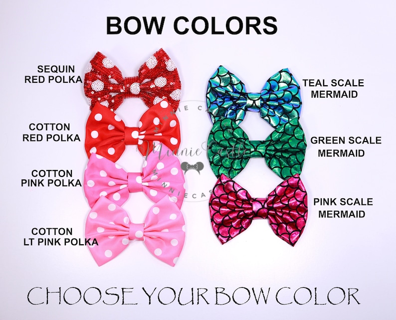 May include: A selection of fabric hair bows in various colors and patterns.  The bows include red polka dot, pink polka dot, light pink polka dot, teal mermaid scale, green mermaid scale, and pink mermaid scale.  Choose your bow color.