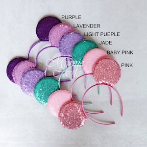 Puede incluir: Surtido de orejas de Minnie Mouse de lentejuelas en varios colores, incluyendo morado, lavanda, morado claro, jade, rosa beb&eacute; y rosa.