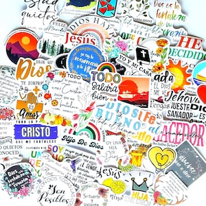 May include: A collection of colorful stickers with various designs and text. The stickers feature religious themes, including phrases like "Dios," "Jesús," and inspirational quotes. Designs include rainbows, hearts, flowers, and sunsets, with a variety of fonts and styles.