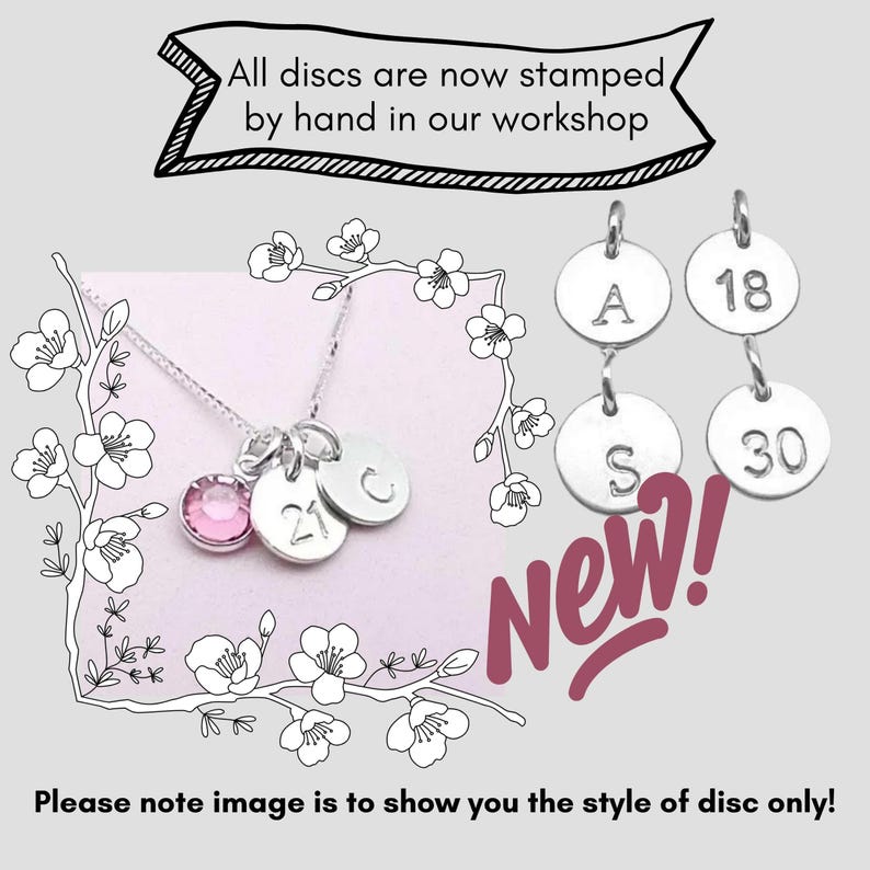 May include: A silver necklace with a pink gemstone pendant and three stamped silver discs. The discs have the letters "A", "S", and "C", and the numbers "18", "21", and "30". The text "All discs are now stamped by hand in our workshop" is at the top.