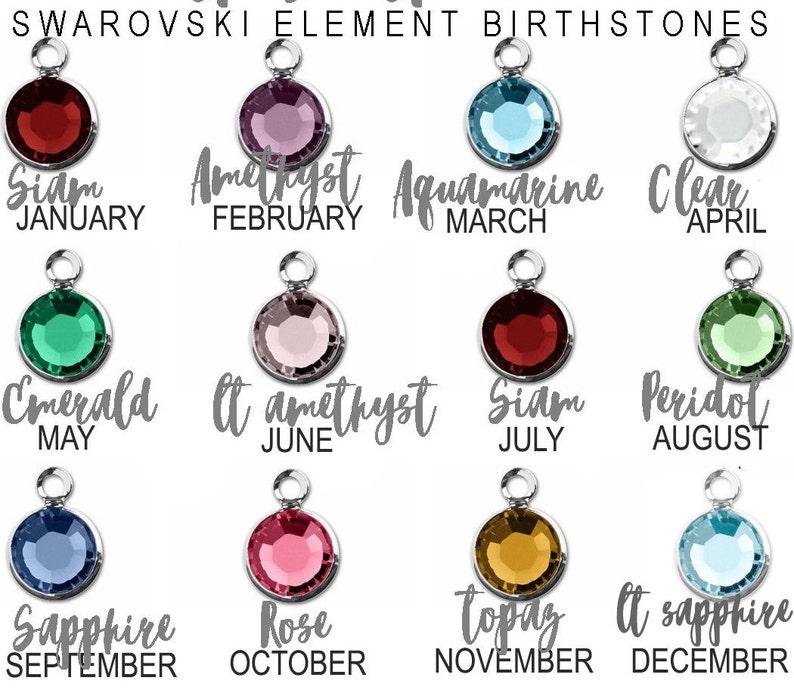 May include: A collection of Swarovski Element birthstone charms. Each charm features a different colored crystal, with the month and stone name written below. The colors include red, purple, blue, clear, green, pink, and yellow.