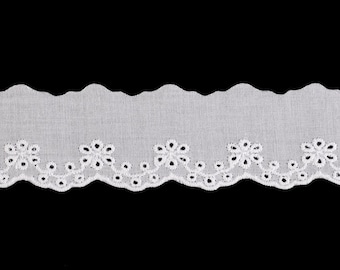 May include: White eyelet lace trim with a scalloped edge and floral cutouts. The trim is made of a lightweight fabric and is suitable for various sewing and craft projects. The design features a repeating pattern of flowers and a decorative border.