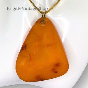 Amber pendant striking very large natural Baltic Sea amber butterscotch dark color zones inclusions collector&#39;s item more to the article...
