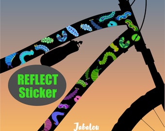 May include: A black silhouette of a bicycle with a colorful sticker design featuring a repeating pattern of caterpillars. The sticker is labeled "Reflect Sticker" and the brand name "Jabalou" is visible at the bottom of the image.
