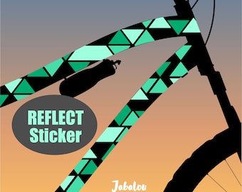 May include: A black bicycle frame with a green and blue geometric pattern sticker. The sticker says "Reflect Sticker" and "Jabalou".