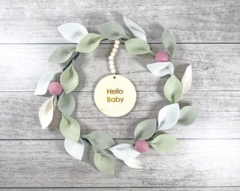 Birth sign wreath leaves baby