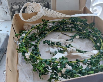 Charming brocante old wedding box with floral wreaths, card and photography