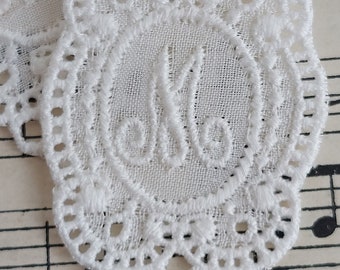 Monogram M embroidered initials laundry mark