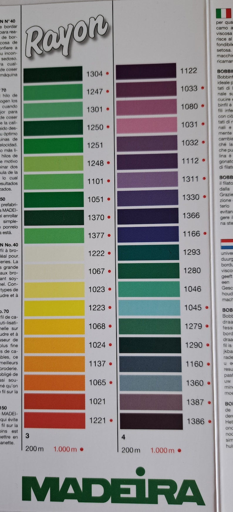 May include: A color chart for rayon thread with a variety of green, blue, purple, and pink shades. The chart is labeled "Rayon" and "Madeira".