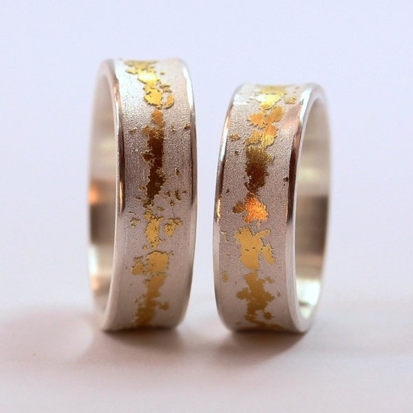 Wedding rings in 925 silver and fine gold, various widths, wedding rings