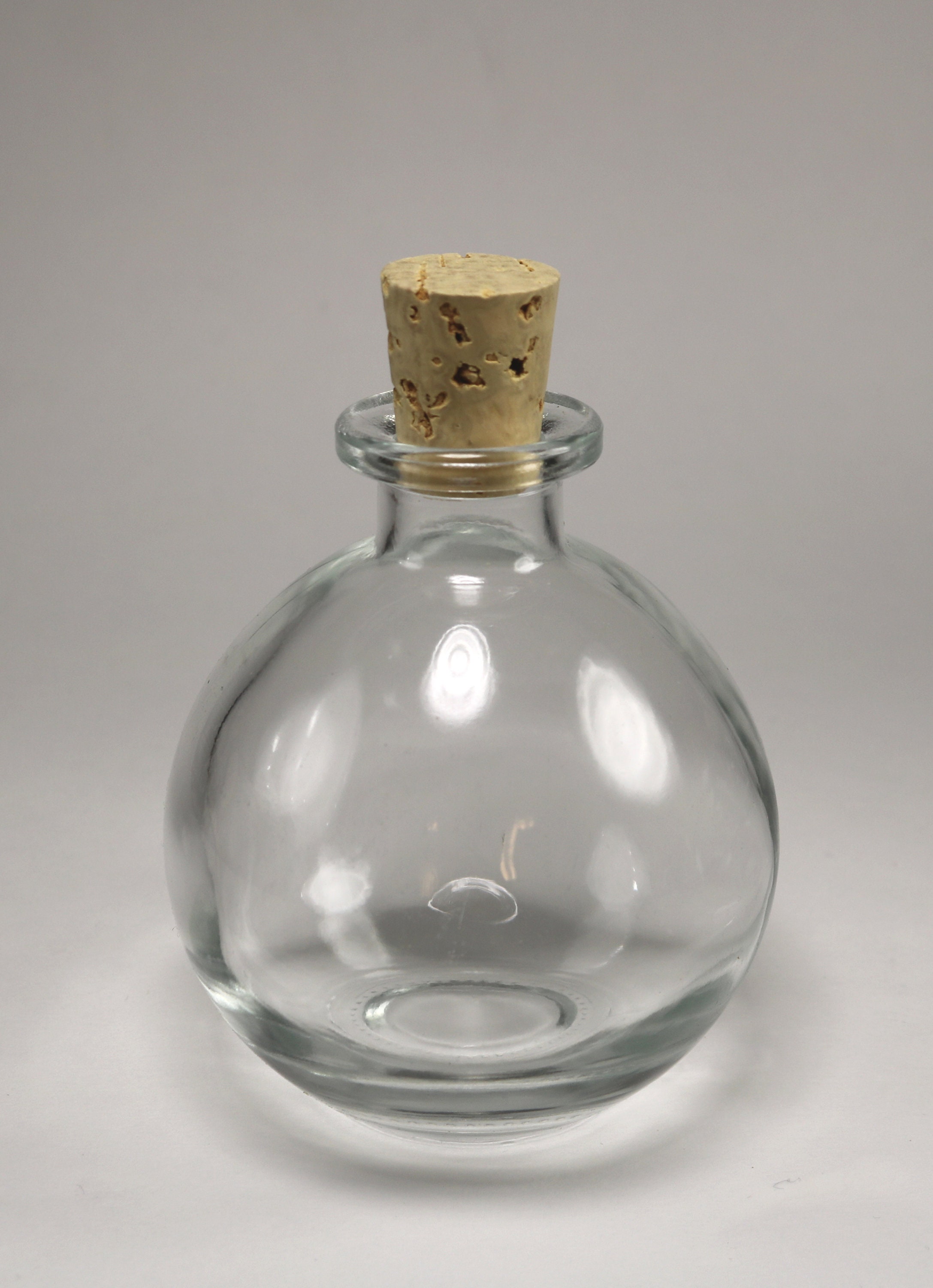NEW SQUARE GLASS POTION BOTTLE WITH CORK ROMAN NUMERALS I IV RAVENHEAD .309 NEW SQUARE GLASS POTION BOTTLE WITH CORK ROMAN NUMERALS I IV RAVENHEAD .309