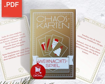 May include: A gold box of Christmas-themed game cards with the text "Chaos-Karten Weihnachts-Spiel Original" on the front. The cards feature illustrations of a Christmas tree, a gift, a Santa Claus, and a feather.