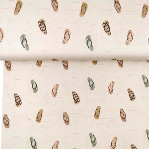 May include: A white fabric with a repeating pattern of brown, green, and pink flip flops. The flip flops are scattered randomly across the fabric.