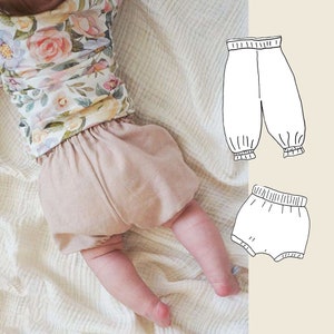 May include: A baby wearing a floral print top and a pair of beige bloomers. Two illustrations of different styles of pants are shown on the right side of the image.
