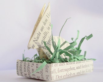 Origami Osterhase aus alten Buchseiten im Osternest