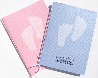 Handmade paper card featuring baby feet for birth