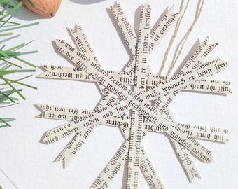 Paper star made from old book pages, in the style of a straw star.