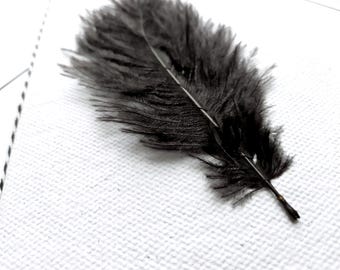 Sympathy card, black feather, laid paper