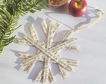 Paper star made from old book pages in the style of a straw star, vintage Christmas tree decoration literature