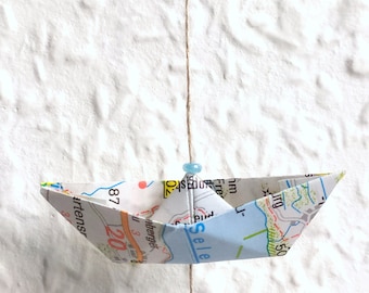 Garland of little boats made from old maps