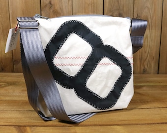 Small shoulder bag made from upcycled sailcloth.