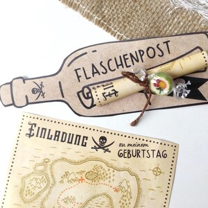 May include: A brown paper bottle with the text "FLASCHENPOST" on it. A rolled up piece of paper with text is tied to the bottle with twine. A green and red candy is tied to the twine. A brown and tan map with the text "Einladung zu meinem Geburtstag" is in the background.