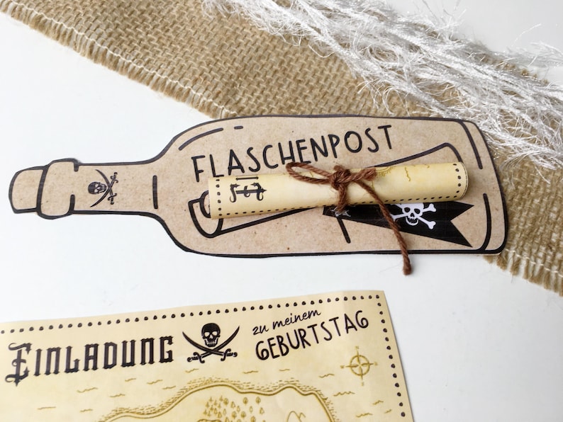May include: A brown paper bottle with a rolled up scroll inside. The bottle has the text "FLASCHENPOST" written on it. The scroll is tied with twine. The bottle is on a white surface. Below the bottle is a brown paper map with the text "Einladung zu meinem Geburtstag" and a skull and crossbones.