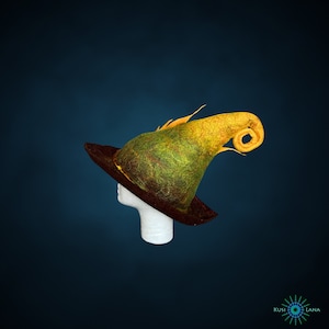 May include: A green and yellow felt witch hat with a curled brim and a pointed crown. The hat is on a white mannequin head.