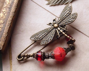 Fire colored dragonfly pin in Art Nouveau style, cloth pin with beads in shades of red