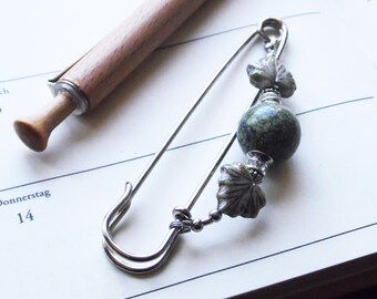 Serpentine cloth pin, silver-tone safety pin, green gemstone and leaves