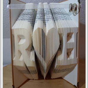 Book folding art with your initials and a big heart