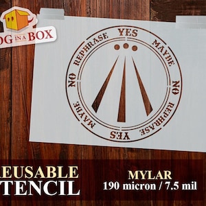 May include: A white reusable stencil with a brown design featuring the words "YES", "MAYBE", and "NO REPHRASE" in a circular pattern. The stencil also includes the text "REUSABLE STENCIL" and "MYLAR 190 micron / 7.5 mil". A "Dog in a Box" logo is in the upper left corner.