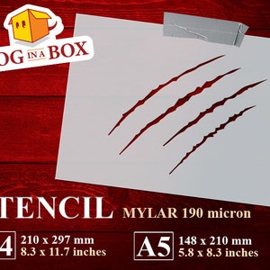 Pode incluir: Um estêncil branco com um design de marca de garra. O estêncil é feito de mylar de 190 mícrons e está disponível nos tamanhos A4 (210 x 297 mm) e A5 (148 x 210 mm).