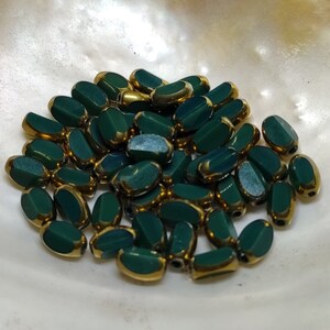 Glass beads plated gold edge oval 7x5x4mm image 1