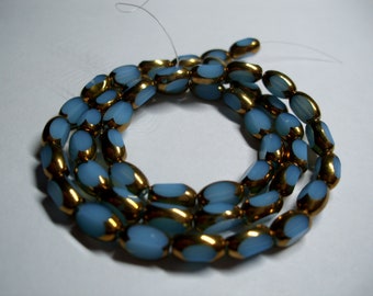 Glass beads plated gold edge oval 7x5x4mm