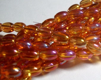 Glass beads orange oval rainbow plated 6mmx4mm