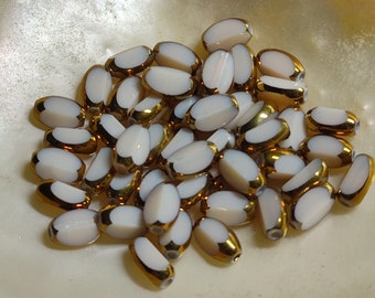 Glass beads plated gold edge oval 7x5x4mm