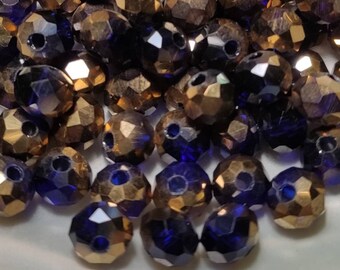 Glass beads faceted 6 x 4 mm ink blue half gold plated