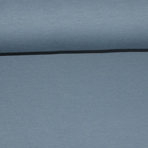 Könnte beinhalten: Nahaufnahme eines hellblauen Stoffes mit glatter Textur.