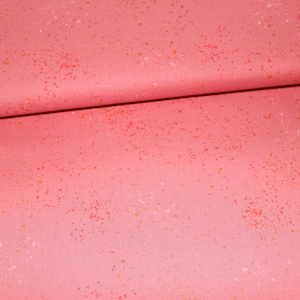 Könnte beinhalten: Nahaufnahme eines rosa Stoffes mit einem gesprenkelten Muster aus weißen und goldenen Punkten.