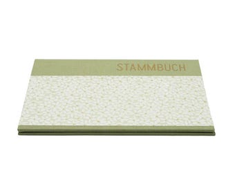 May include: A rectangular book with a sage green fabric cover featuring the word STAMMBUCH in gold lettering. The center of the cover displays a wide horizontal band with a repeating white floral pattern on a light green background.