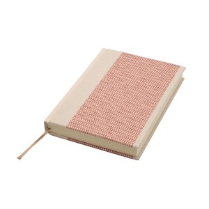 May include: A rectangular notebook with a cream-coloured fabric spine and a textured, woven coral-pink panel covering the majority of the front cover. The notebook features a thin, matching coral-pink ribbon bookmark extending from the bottom edge.