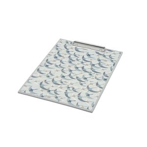 May include: A rectangular clipboard featuring a repeating pattern of stylized birds in shades of blue, gray, and white against a light background. The clipboard includes a silver-toned metal clip mechanism at the top edge for securing documents.