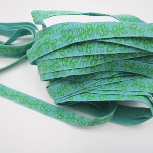 3 m narrow turquoise woven ribbon with green pattern (1 cm wide) 1-12-23