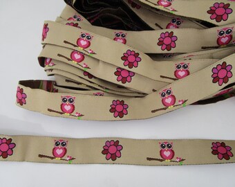 1.50 m narrow woven ribbon beige with pink owl pattern (1.8 cm wide) 66-6-22