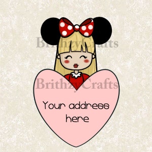 May include: A cartoon illustration of a girl with blonde hair, black mouse ears, and a red bow with white polka dots. She is holding a pink heart with the text "Your address here". The girl is wearing a red dress.