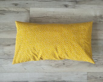 Cushion cover with irregular dots on yellow